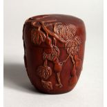 A SMALL JAPANESE CARVED WOOD BOX AND COVER, carved with fruit 2.75ins