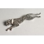 A SILVER MARCASITE AND MOTHER OF PEARL BROOCH