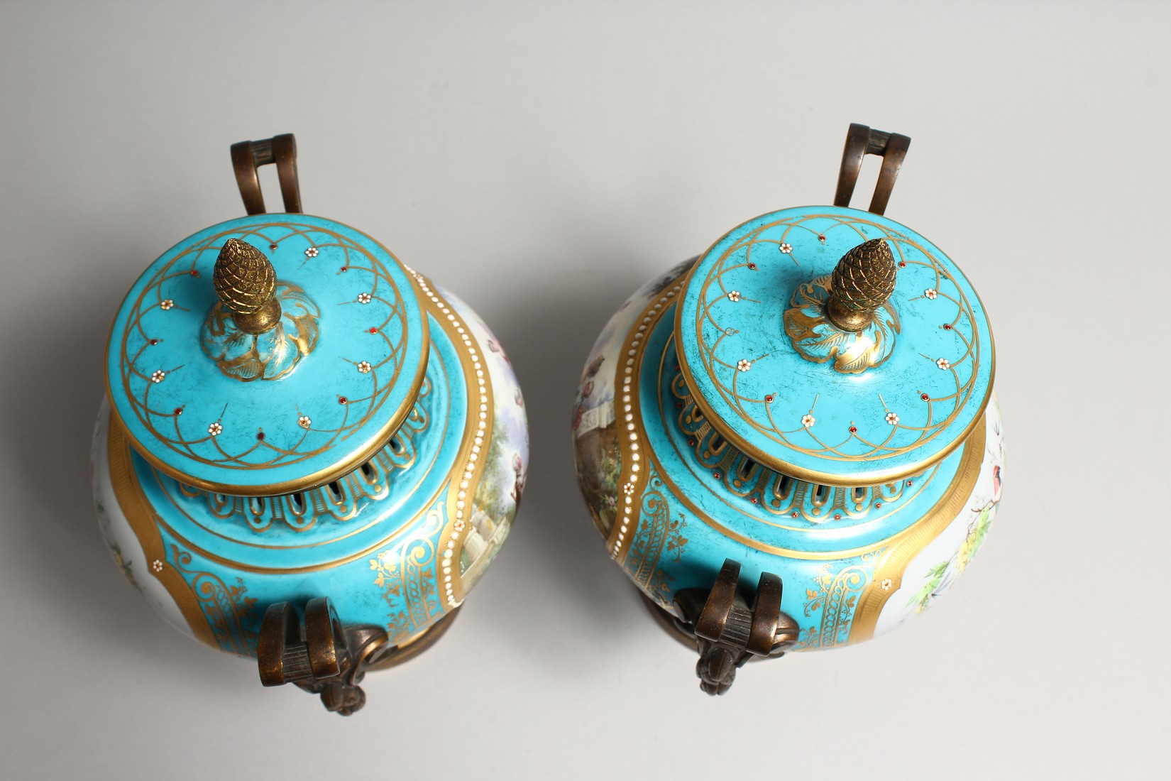 A SUPERB PAIR OF SEVRES PORCELAIN ORMOLU MOUNTED CIRCULAR VASES AND COVERS, painted with reverse - Image 5 of 6