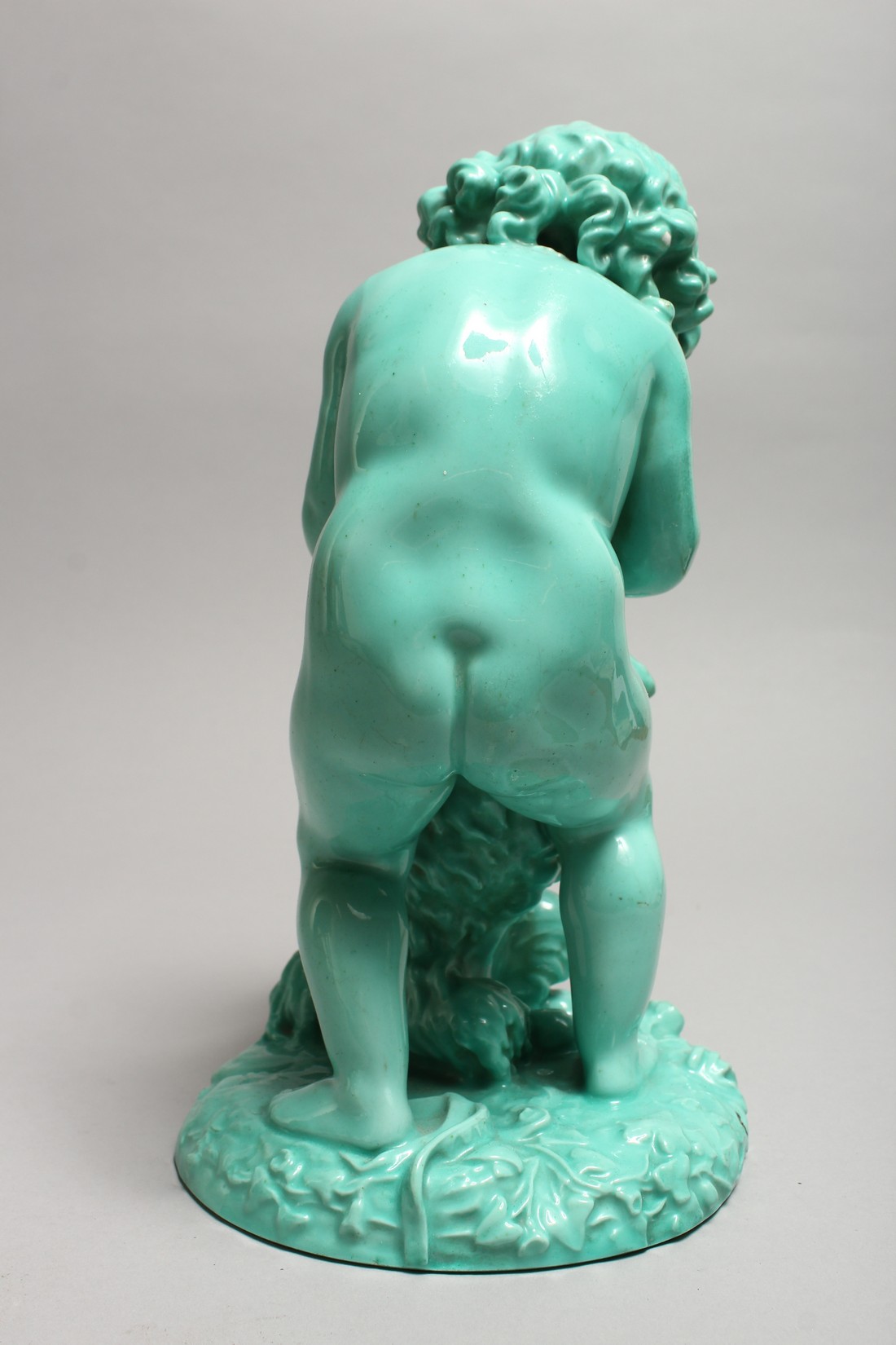 A CONTINENTAL TURQUOISE GLAZED POTTERY FIGURE of a young girl playing with a dog. 11ins high. - Image 4 of 9