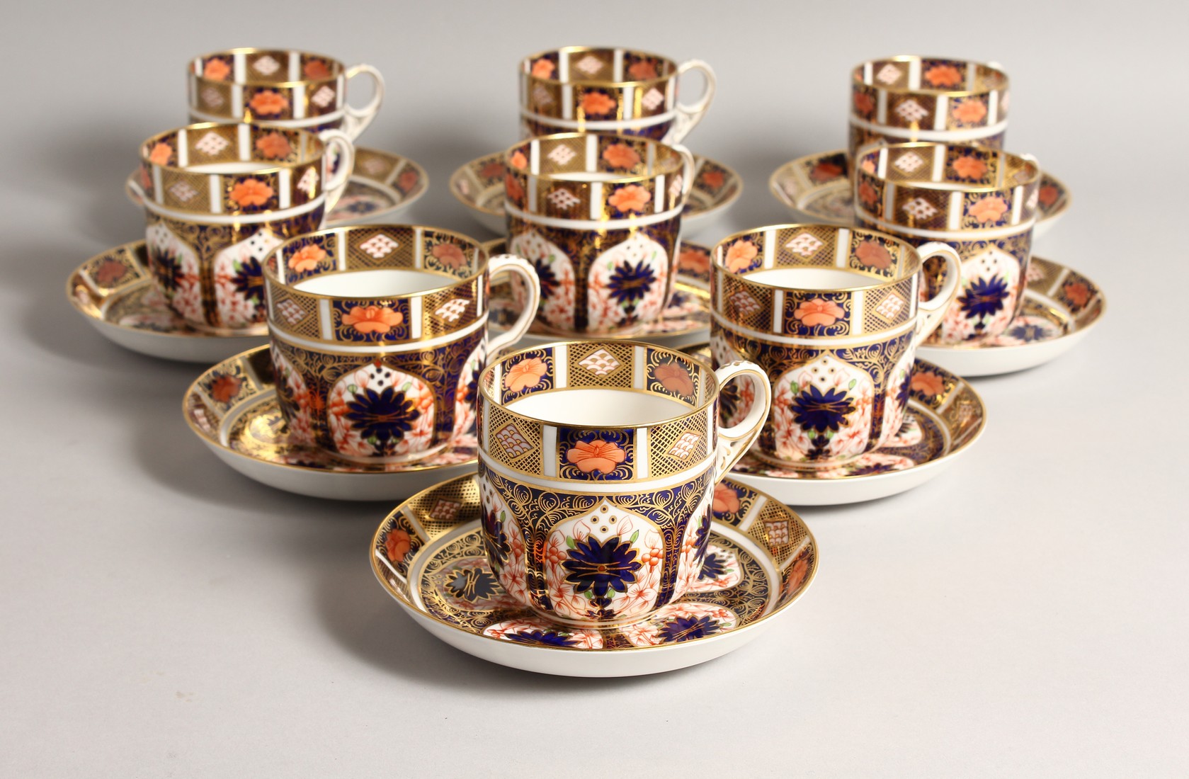 A SET OF NINE ROYAL CROWN DERBY JAPAN PATTERN CUPS AND SAUCERS. No. 1128