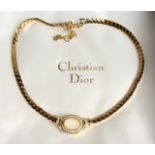 A CHRISTIAN DIOR 1980'S GILT NECKLACE in a Christian Dior bag