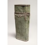 A GEORGIAN WHISKY FLASK in a shagreen case, with silver garlands 6.5ins long (some damage).