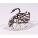 A CUT GLASS .835 SILVER SWAN, with silver head, neck and wings. 4.5ins long.