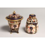 A ROYAL CROWN DERBY JAPAN PATTERN CIRCULAR VASE AND COVER. No. 15838 & 1128, 4.25ins high and a