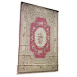 AN ABUSSON STYLE WALL HANGING/CARPET, 20TH CENTURY, pink ground within a beige ground border, with
