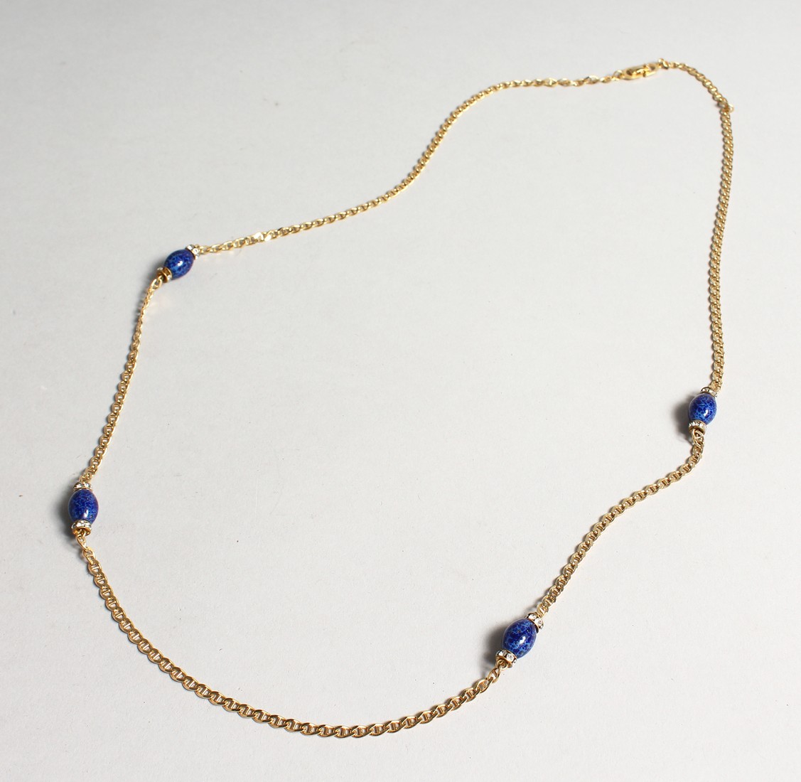 A CHRISTIAN DIOR 1980'S GILT AND LAPIS NECKLACE in a Christian Dior box.