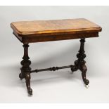 A GOOD VICTORIAN FIGURED WALNUT CARD TABLE, with folding rounded rectangular top, on a pair of