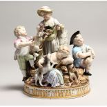 A SUPERB 19TH CENTURY MEISSEN GROUP with five children, a dog, two lambs and garlands on a