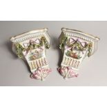 A GOOD PAIR OF MEISSEN STYLE PORCELAIN WALL BRACKETS, hung with garlands 9ins long