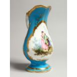 A GOOD SEVRES PORCELAIN EWER, blue ground edged in gilt and painted with three panels of figures and
