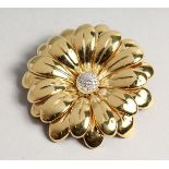 A SUPERB 18CT GOLD FLOWER BROOCH 7cm diameter, with P set diamond centre. 48gms