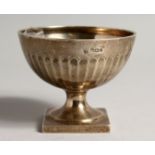 A CIRCULAR RIBBED PEDESTAL SUGAR BOWL on a square base Sheffield 1905, maker T. Bradbury.