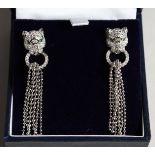 A PAIR OF SILVER PANTHER HEAD TASSLE EARRINGS