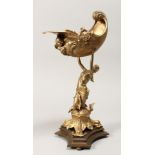 A GILT BRONZE CENTREPIECE, modelled as a classical female figure holding a conch shell. 16ins high