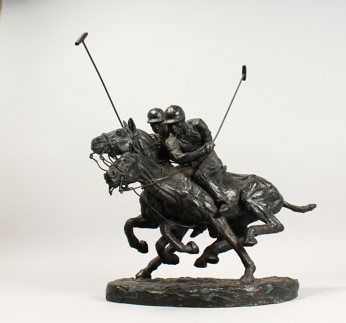 A BRONZE RESIN GROUP,two polo players on horse back in action 14ins high
