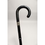 AN UNUSUAL METAL FOLDING WALKING STICK 2ft 6ins long