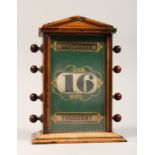 A VICTORIAN WOODEN DESK CALENDER 7ins high