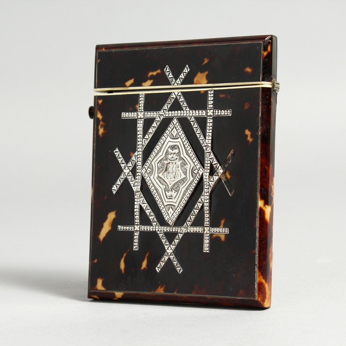 A VICTORIAN SILVER INLAID TORTOISESHELL CALLLING CARD CASE.