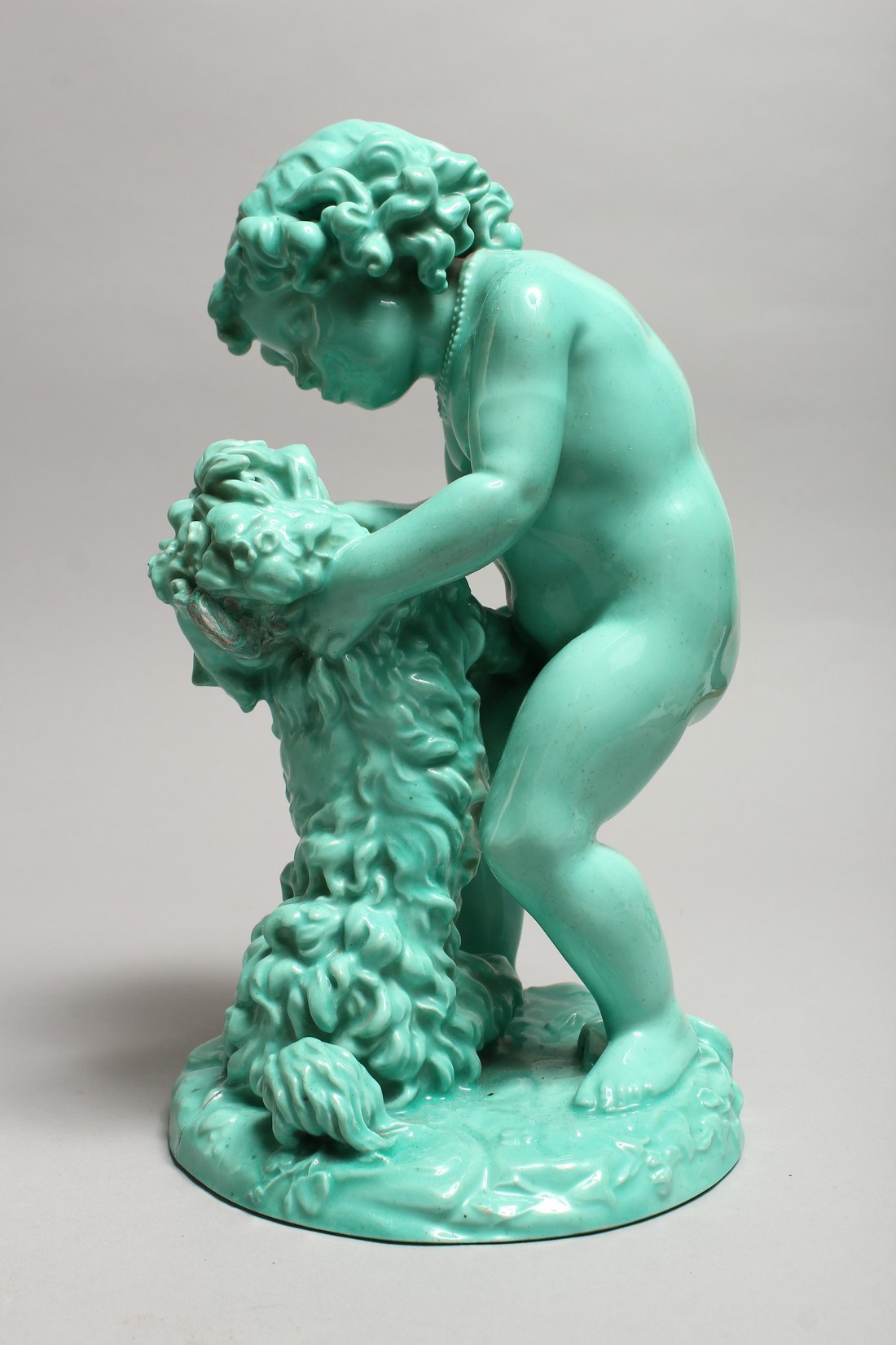 A CONTINENTAL TURQUOISE GLAZED POTTERY FIGURE of a young girl playing with a dog. 11ins high. - Image 5 of 9