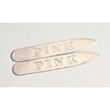 A PAIR OF 'PINK' BOXED SILVER COLLAR STIFFENERS.