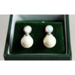 A PAIR OF PEARL DROP EARRINGS