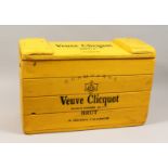 A YELLOW PAINTED WOODEN CHAMPAGNE CRATE "VUEVE CLIQUOT". 27.5ins long X 18 ins high