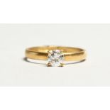 AN 18CT GOLD SOLITAIRE DIAMOND RING