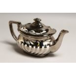 A SILVER LUSTRE DECORATED POTTERY TEA POT 10ins long