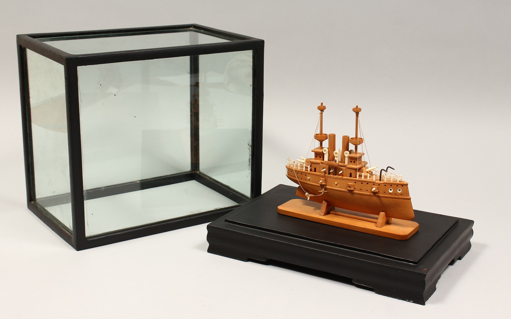 A GOOD BOXWOOD AND BONE MODEL OF A JAPANESE WAR SHIP. Signed YASHIMA, in a display case. Boat 6.