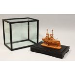 A GOOD BOXWOOD AND BONE MODEL OF A JAPANESE WAR SHIP. Signed YASHIMA, in a display case. Boat 6.