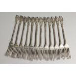 A RARE SET OF TWELVE GEORGE III CAST HESTER BATEMAN DESIGN FORK with cast head finish. London 1782