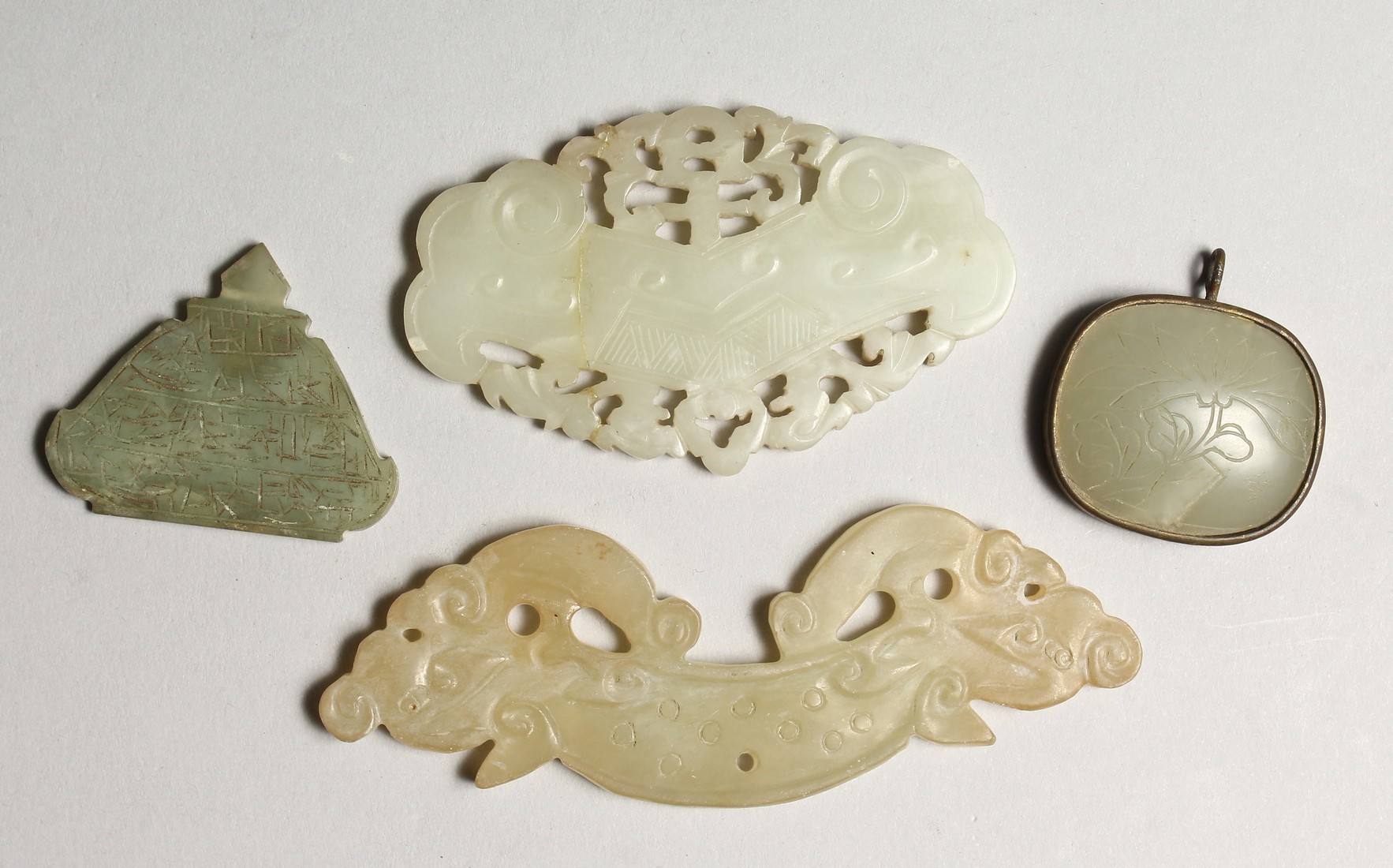 FOUR CHINESE CARVED JADE CARVINGS