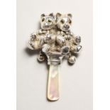 A SILVER DOUBLE TEDDY MOTHER OF PEARL RATTLE.