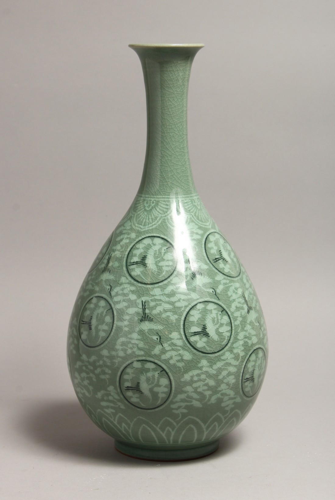 A KOREAN POTTERY BULBOUS VASE painted with storks 14ins high.