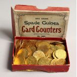 A BOX OF SPADE GUINEA GILT COUNTERS dated 1797.