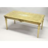 A 20TH CENTURY DECORATIVE GILTWOOD LOW TABLE, with floral painted decoration, on turned tapering