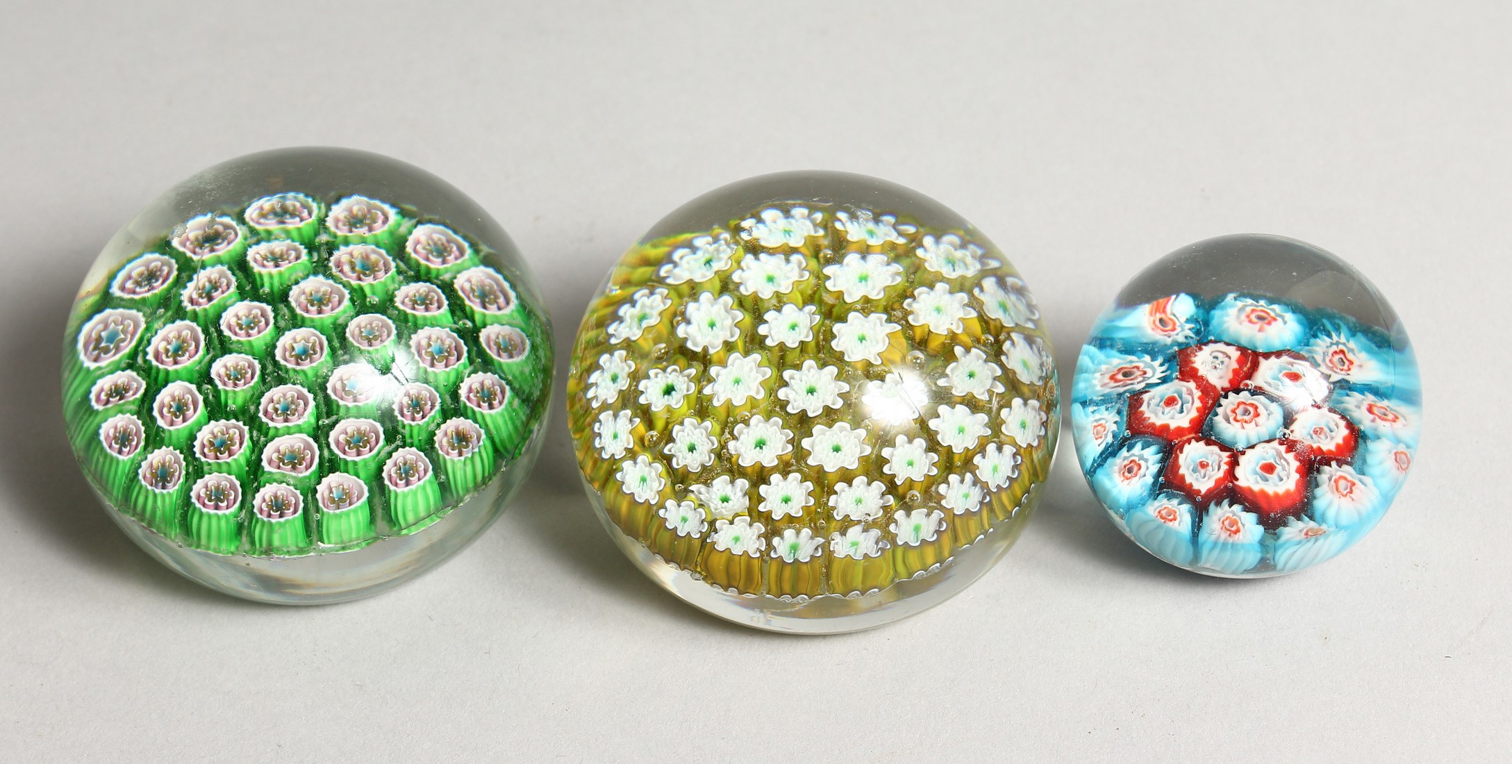 THREE MILLEFIORI PAPERWEIGHTS.