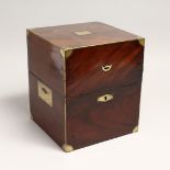 A GOOD REGENCY MAHOGANY SQUARE DECANTER BOX with brass edges and only two decanter stoppers. 8ins.
