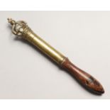 A 19TH CENTURY TURNED WOOD AND BRASS TIPSTAFF, the top asa crown with a cross. Engraved C. 19W. 6.