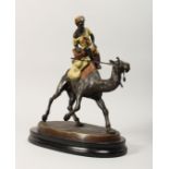 A LARGE VIENNA STYLE COLD PAINTED BRONZE OF AN ARAB ON A CAMEL, mounted on a marble base. 15ins