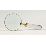 A MAGNIFYING GLASS WITH GLASS HANDLE