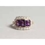 A 9CT GOLD EMERALD CUT AMETHYST AND DIAMOND RING
