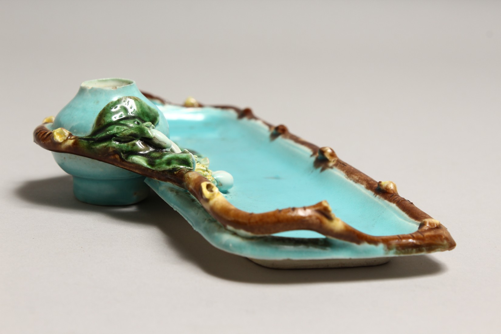 A MAJOLICA TURQUOISE GLAZED DESK STAND with inkwell, of naturalistic form. 9ins long. - Image 3 of 3