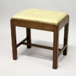 A GEORGE III MAHOGANY RECTANGULAR STOOL, with drop-in seat on moulded square legs united by