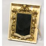 A VERY GOOD 19TH CENTURY FLORENTINE CARVED GILT WOOD MIRROR. 3ft 3ins high, 2ft 2ins wide overall.