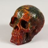 A RESIN MODEL OF A HUMAN SKULL 6ins long