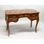 A FRENCH STYLE MARQUETRY INLAID BUREAU PLAT of shaped outline, with an arrangement of five drawers