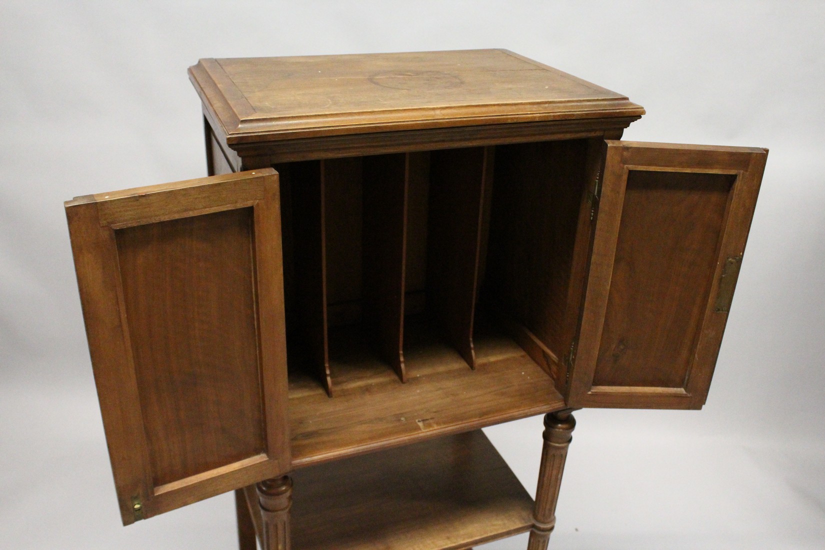 A LATE 19TH CENTURY FRENCH WALNUT MUSIC CABINET, with a pair of carved panelled doors enclosing - Image 4 of 7