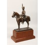 A BRONZE OVERLAID COMPOSITE MODEL OF A HUSSAR ON HORSEBACK, on a wooden plinth base 17ins high.